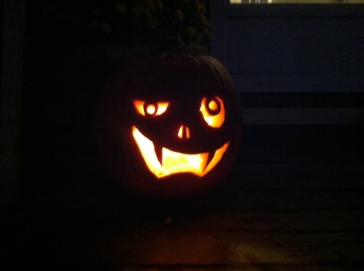 jack-o-lantern's fanged grin in the dark
