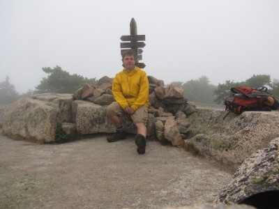 Dan sitting at the foggy top of Champlain mountain