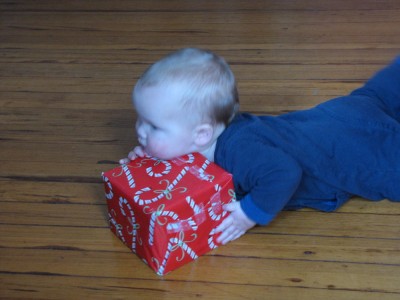 Elijah resting his chin on a present