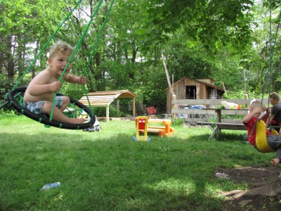 Lijah swinging in the backyard