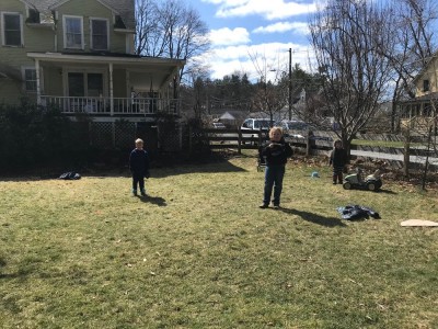 the boys playing catch in the yard