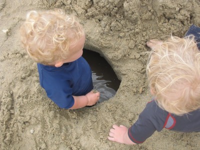 the view from above of Lijah in the water-filled hole