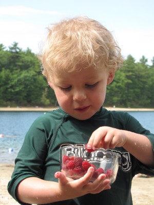 Zion eating raspberries at the pond