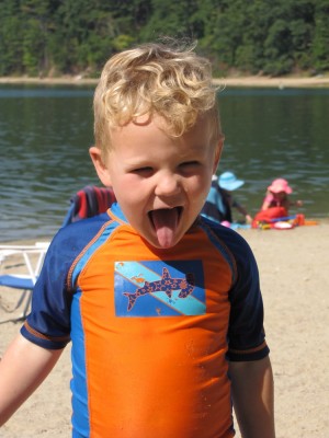 Lijah at the beach sticking out his tongue