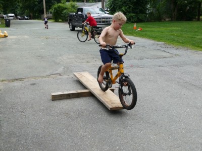 Zion guiding his bike over a small ramp
