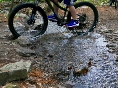 Zion splashing his bike through a little stream