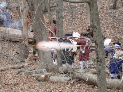 reenactors firing a volley