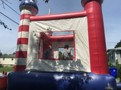 Zion and Lijah in a castle-shaped bounce house