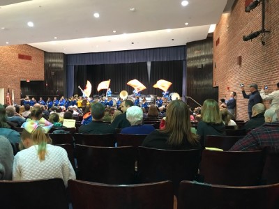 the marching band playing in the high school auditorium