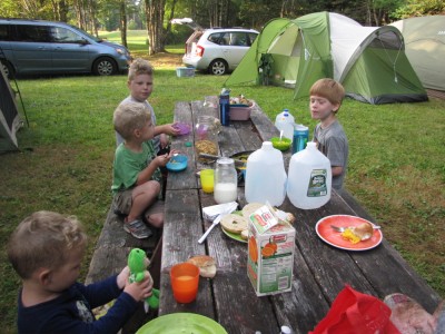 kids eating breakfast at the campsite