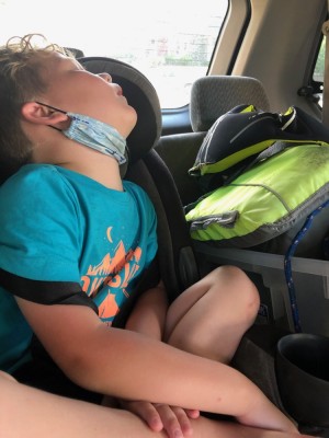 Lijah sleeping in his car seat