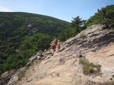 the boys walking along a sloping ridge on the west side of Champlain