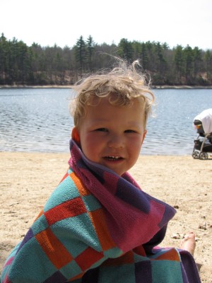Lijah smiling with this towel over him