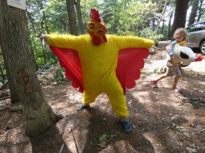 Harvey posing in a chicken costume, Elijah holding a stuffed chicken