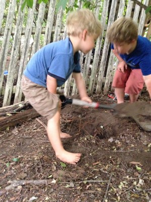 Zion and Harvey digging a hole