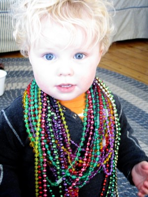 Harvey loaded up with Mardi Gras beads from a church fair