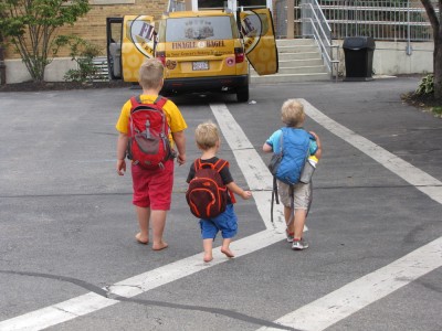 the three boys, in backpacks, headed into church