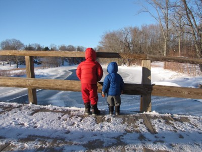 Harvey and Zion on the Old North Bridge looking down on the frozen river