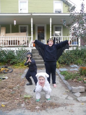 sheep Lijah, ninja Zion and bat Harvey posing in front of the house