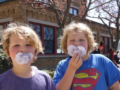 Zion and Elijah with cotton candy stuffed in their mouths