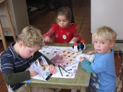 Harvey, Zion, and their cousin Leighanna working on an art project
