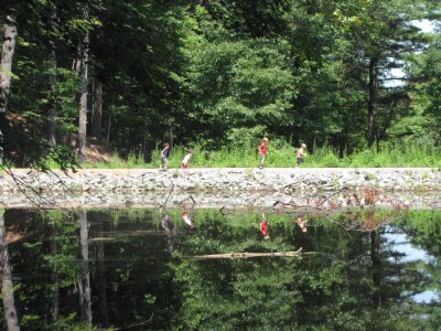 rising first graders running along a dike