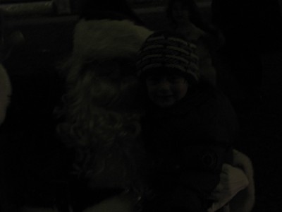 Julen sitting on Santa's lap... in the very dark
