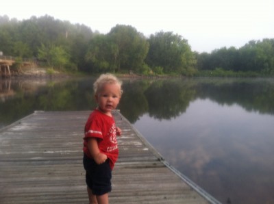 Lijah standing on the dock at the boat launch