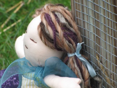 a close-up of the doll's yarn hair