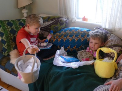 Zion and Lijah on the couch with Easter baskets