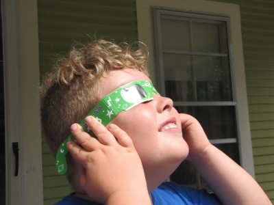 Harvey looking at the eclipse through the special glasses