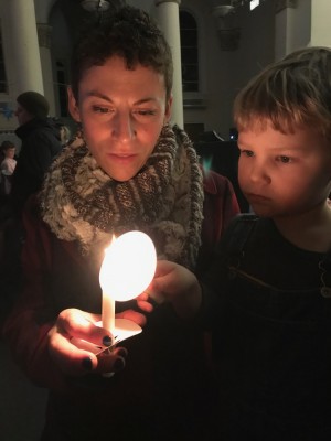 Leah and Lijah with candles at the Christmas Eve service