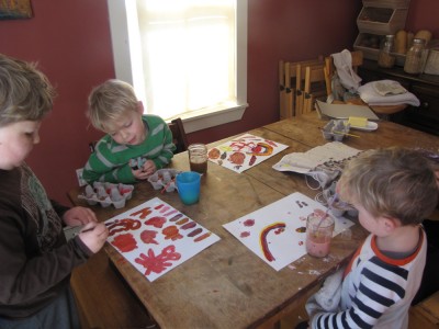 the boys painting at the kitchen table