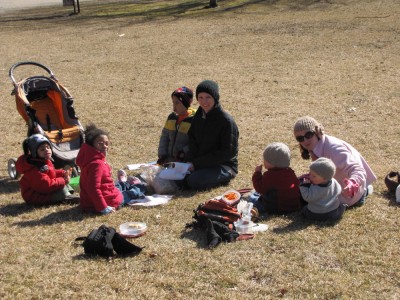the archibalds and friends picnicking with coats on