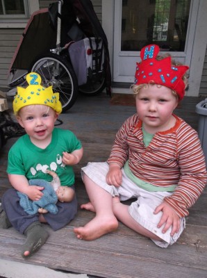 Harvey and Zion sitting on the porch in their felt crowns