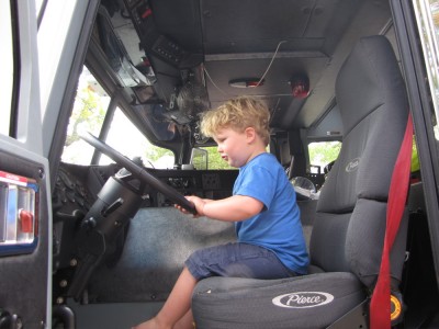 Harvey in the cab of a fire truck