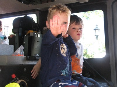 Lijah and Liam in a fire truck