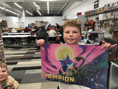 Harvey holding the playmat he recieved for his first Cup win