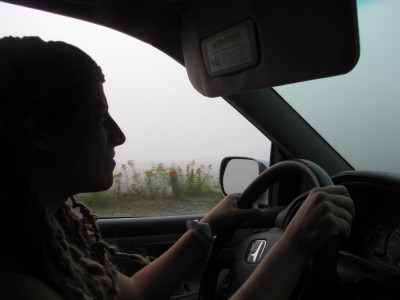 Leah driving the car through the fog