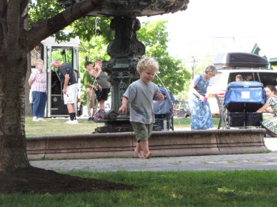 Harvey running back from the fountain in the park