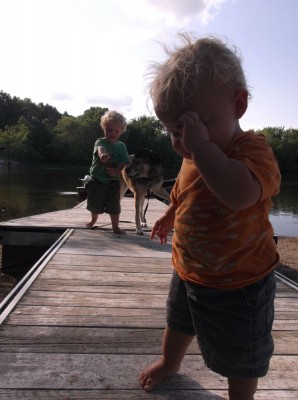 the boys playing on the dock