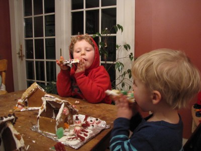 Harvey and Zion eating roof panels off their gingerbread houses