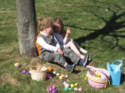 Harvey and Taya sitting together by the tree, surrounded by empty eggs