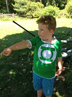 Harvey in his newly-made Green Lantern shirt, using his power ring