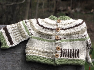 white, green, and brown sweater