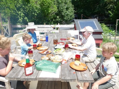 the boys and grandparents eating lunch on the deck