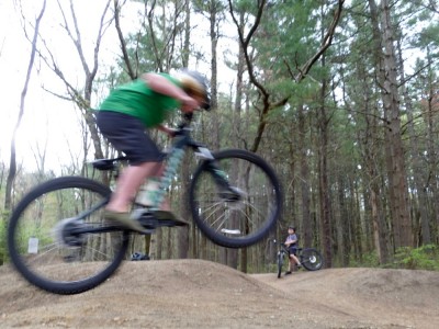 Harvey jumping his bike on the pump track