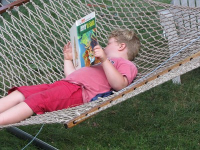 Harvey in the hammock reading an Asterix book