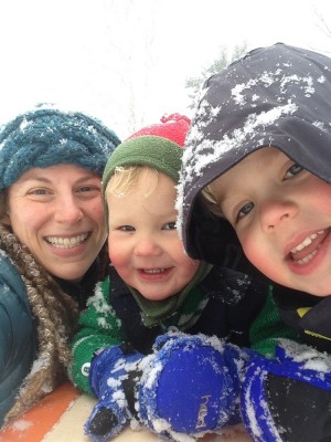 Mama, Lijah, and Zion smiling in the snow