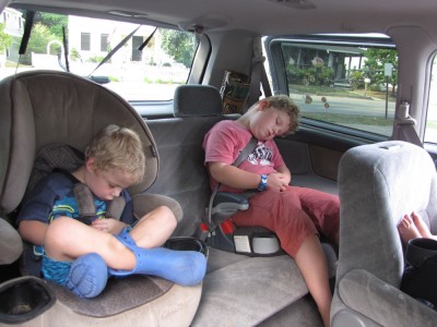 Zion and Harvey asleep in the car